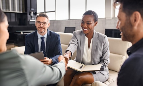 "business people shaking hands during meeting"