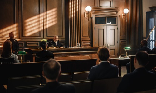 "judge presiding over case in courtroom"