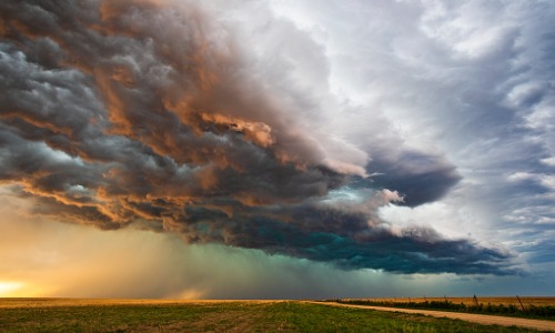 "stormy sky over field"