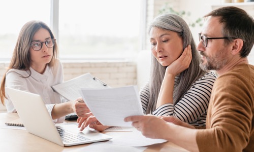 "woman consulting with couple"