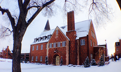"red brick building in snow"