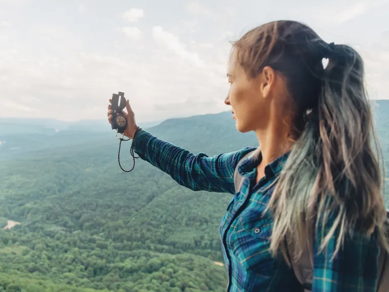 woman using a compass