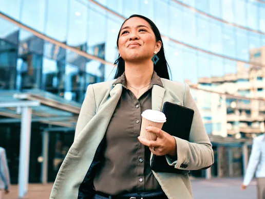 A woman walking confidently by a courthouse