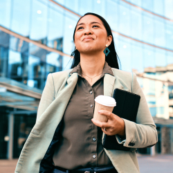 a confident woman walking outside