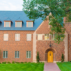exterior of brick building with dark roof