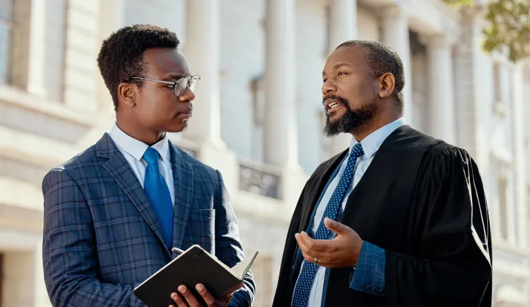 A judge and another person speaking
