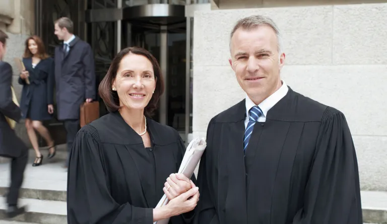 judges standing together outside courthouse