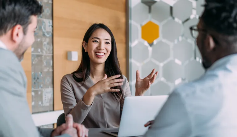 A woman speaking with clients