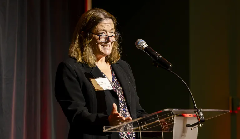 Justice Melissa Hart speaking at the 2025 Rebuilding Justice Award Dinner 