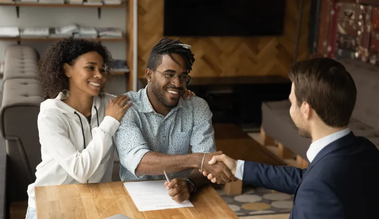 A lawyer shaking the hand of a client 