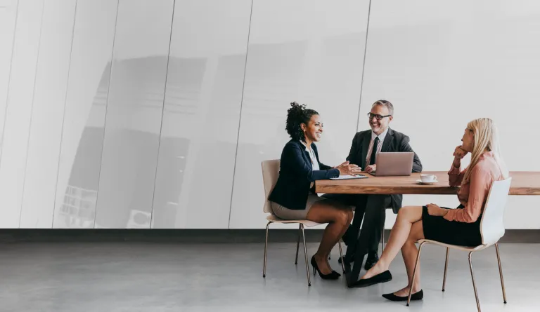 A group of people sitting at a table