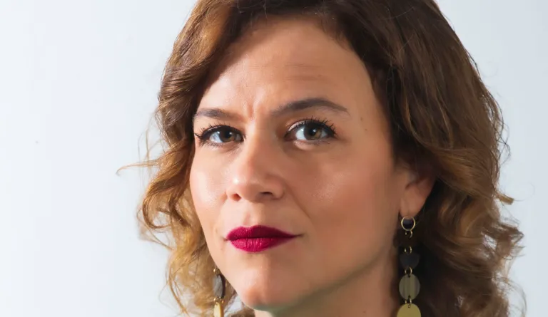 headshot of woman with red lipstick