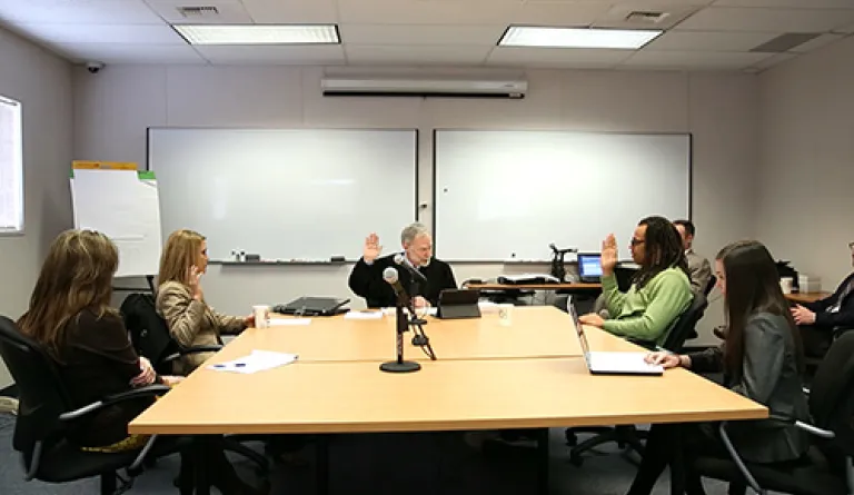 judge mediating hearing between couple