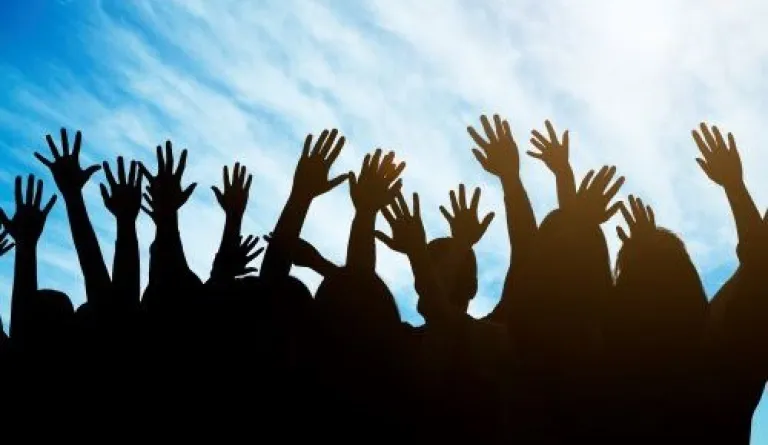 hands raised toward sky