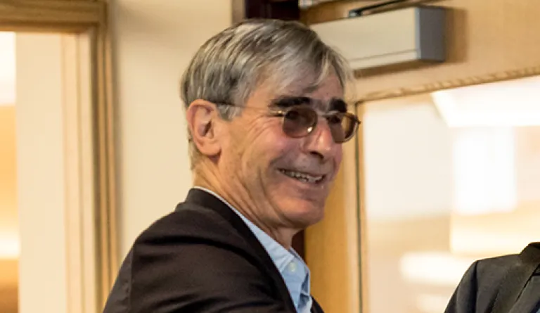 man with glasses smiling