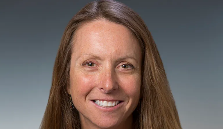 headshot of woman with long hair