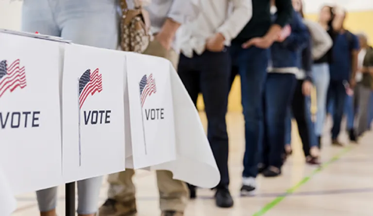 people waiting in line to vote