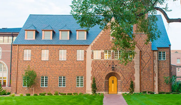 exterior of brick building with dark roof