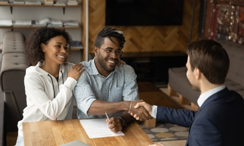 A lawyer shaking the hand of a client 