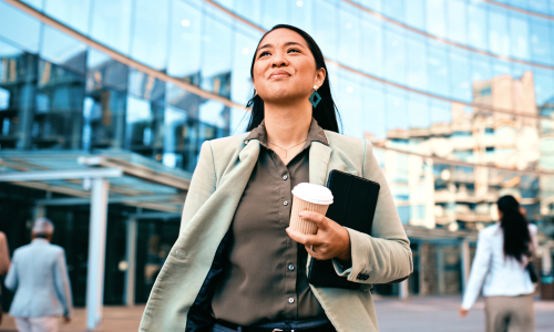 a confident woman walking outside