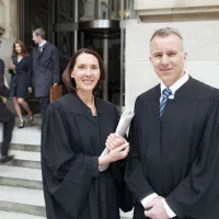 judges standing together outside courthouse