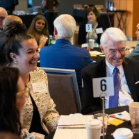 A group of people sitting at a table. 