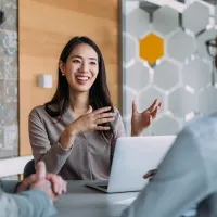 A woman speaking with clients