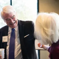 Chief Justice Nathan L. Hecht (Ret.) giving someone a hug