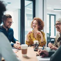 A group of researchers laughing together. 