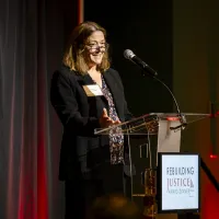Justice Melissa Hart speaking at the 2025 Rebuilding Justice Award Dinner 