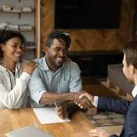 A lawyer shaking the hand of a client 