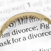 divorce paperwork with gold ring on top