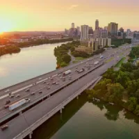 bridge over river at sunset