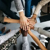 closeup of hands stacked together