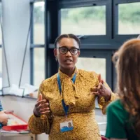 community workers discussing in circle