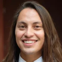 headshot of long-haired man