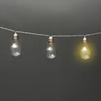 garland of lightbulbs with one glowing on gray background