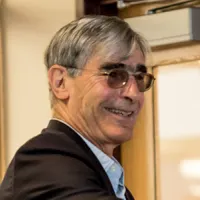 man with glasses smiling