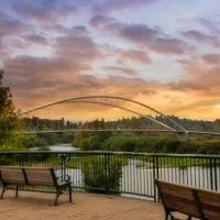park benches on riverfront at sunset