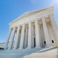 exterior of U.S. Supreme Court building on sunny day