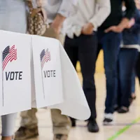 people waiting in line to vote