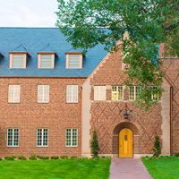 exterior of brick building with dark roof