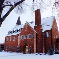 red brick building in snow