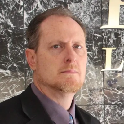 headshot of man with facial hair