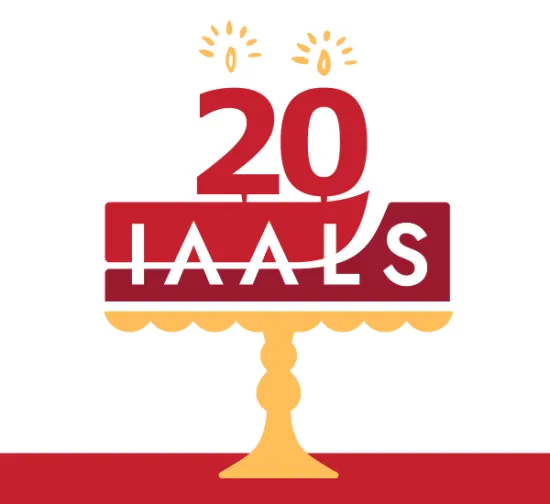 IAALS logo as a birthday cake with candles spelling 20