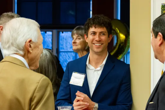 Three people talking and smiling at IAALS 20th Birthday Party