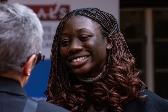 Woman smiling at IAALS 20th Birthday Party