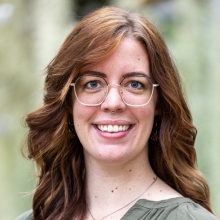 headshot of woman with glasses