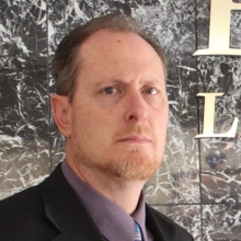 headshot of man with facial hair