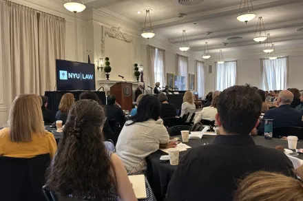 A panel with a crowd